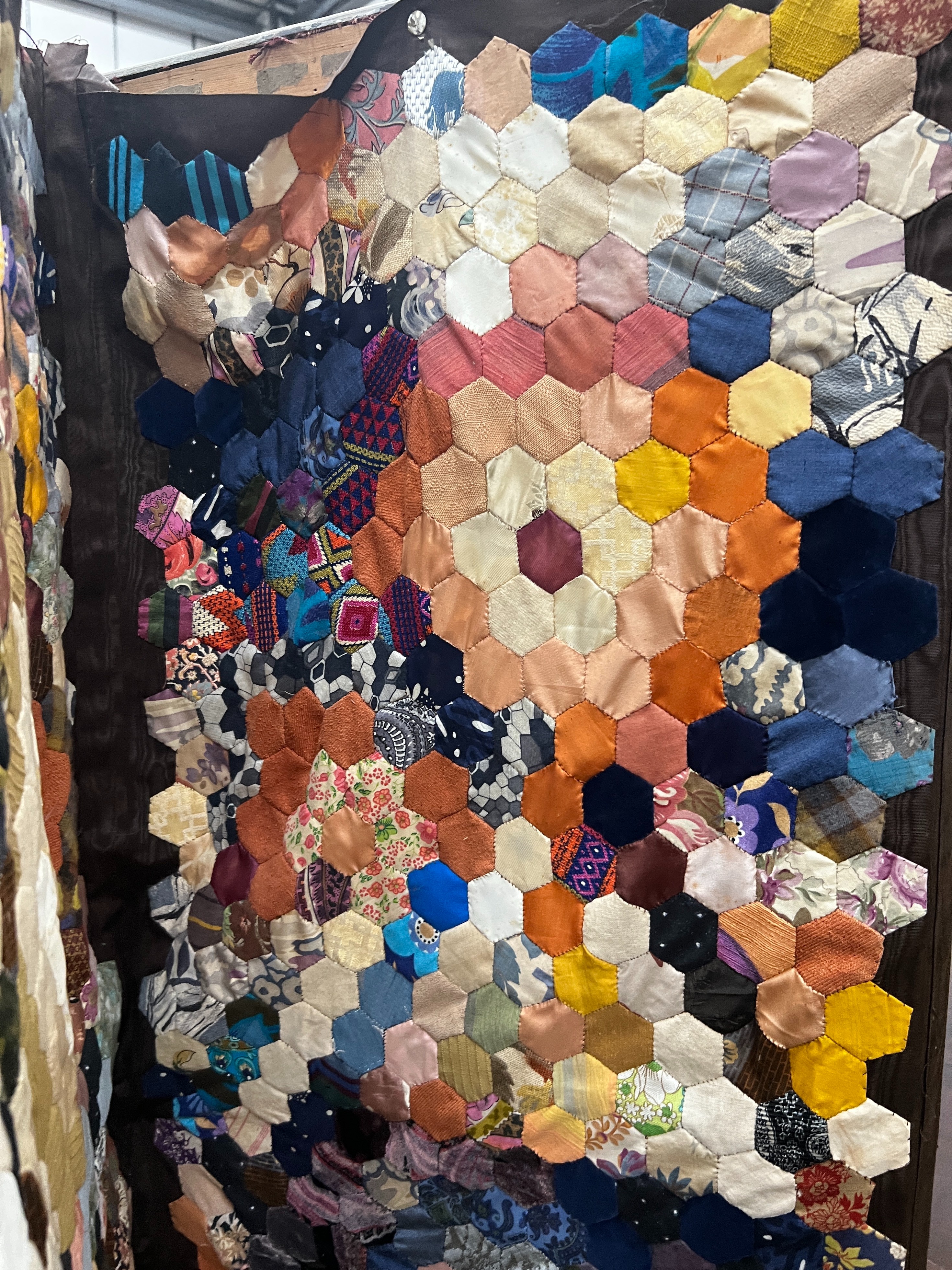 A four fold dressing screen with patchwork fabric panels, each panel width 55cm, height 177cm